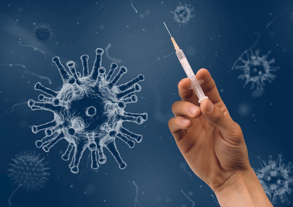 Vaccine in Hand and Virus
